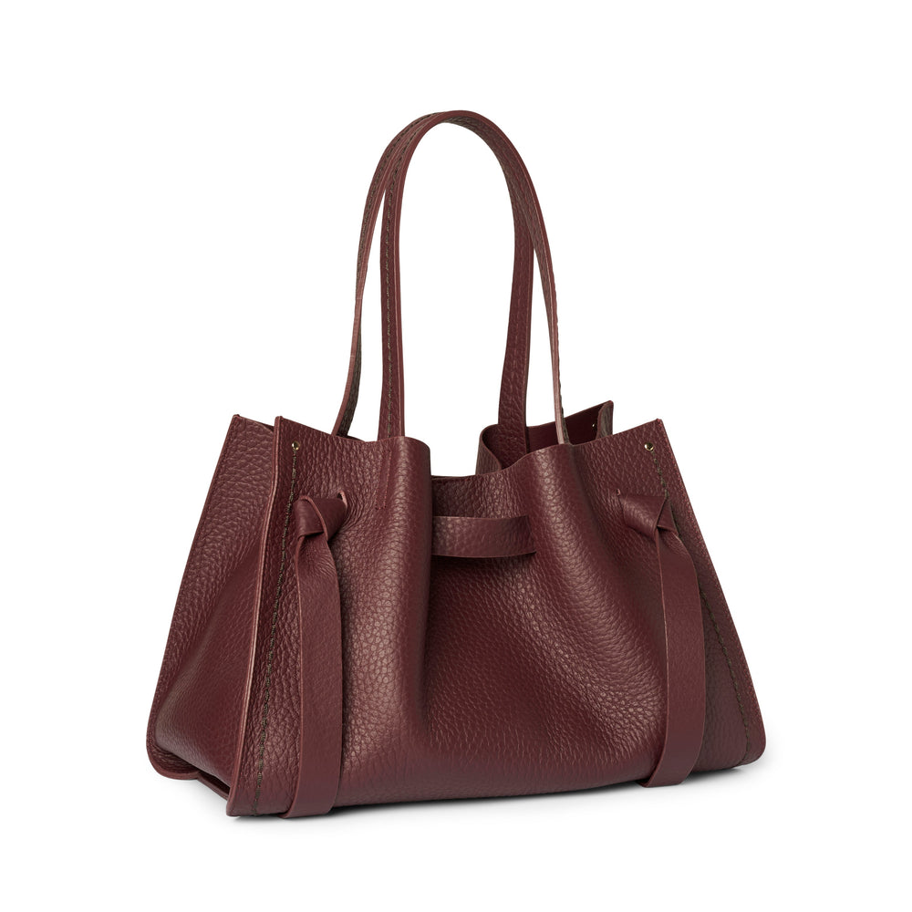 Brown leather handbag on a white background