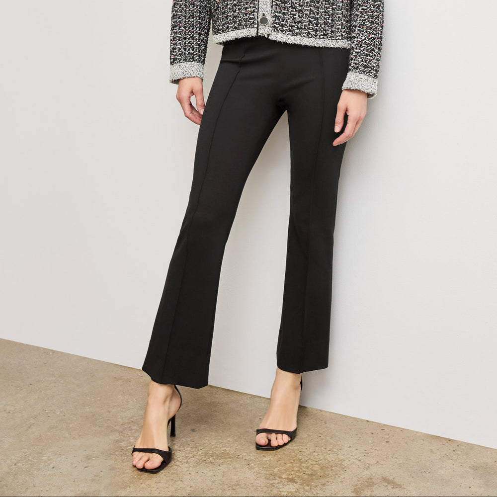 Front image of a woman wearing the allyn pant in black
