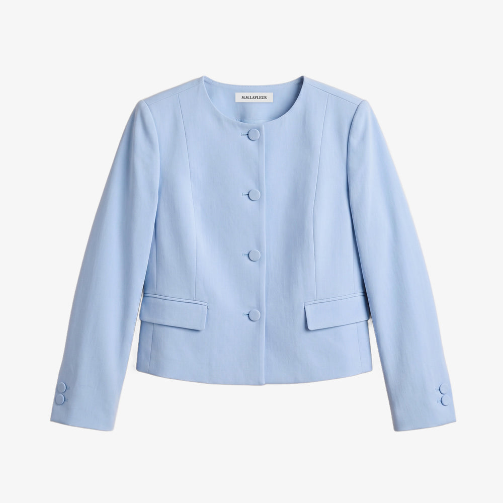 A light blue cropped jacket with a round neckline, three-quarter sleeves, and a buttoned front, shown on a plain light gray background.