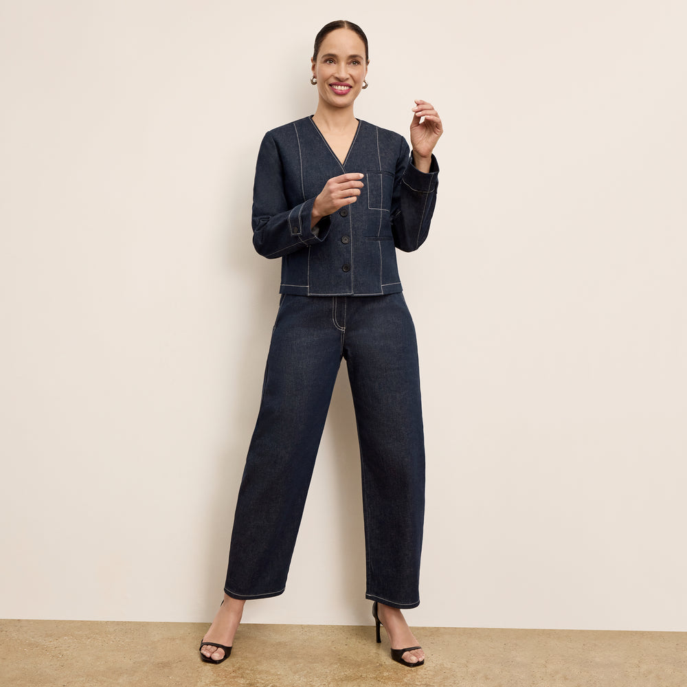 front image of a woman wearing the ayla jacket in midnight wash
