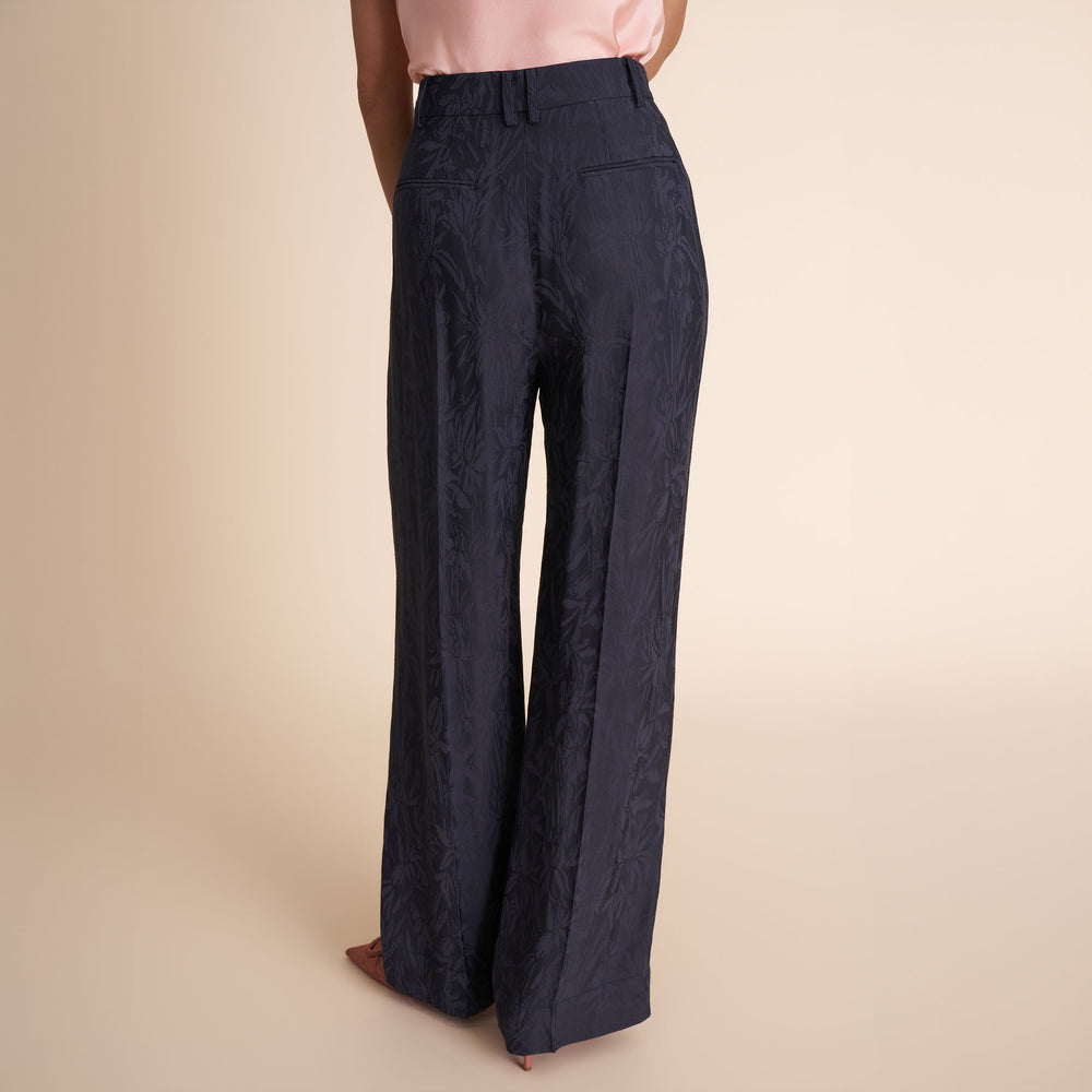 Navy blue pants on a beige background