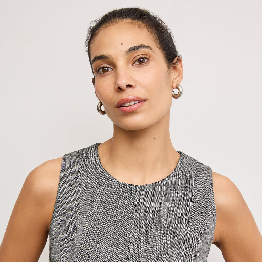 Front image of a woman wearing the carolina dress in Black/White Porto Weave
