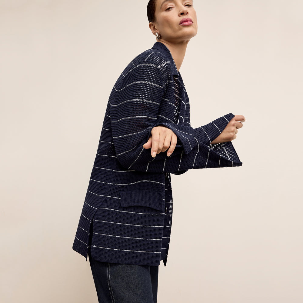 front image of a woman wearing the cody jardigan in dot knit