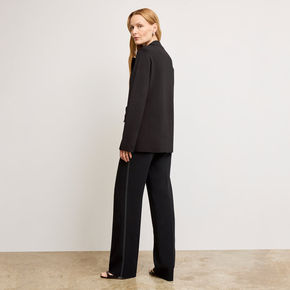 back image of a woman wearing the cody jardigan in black