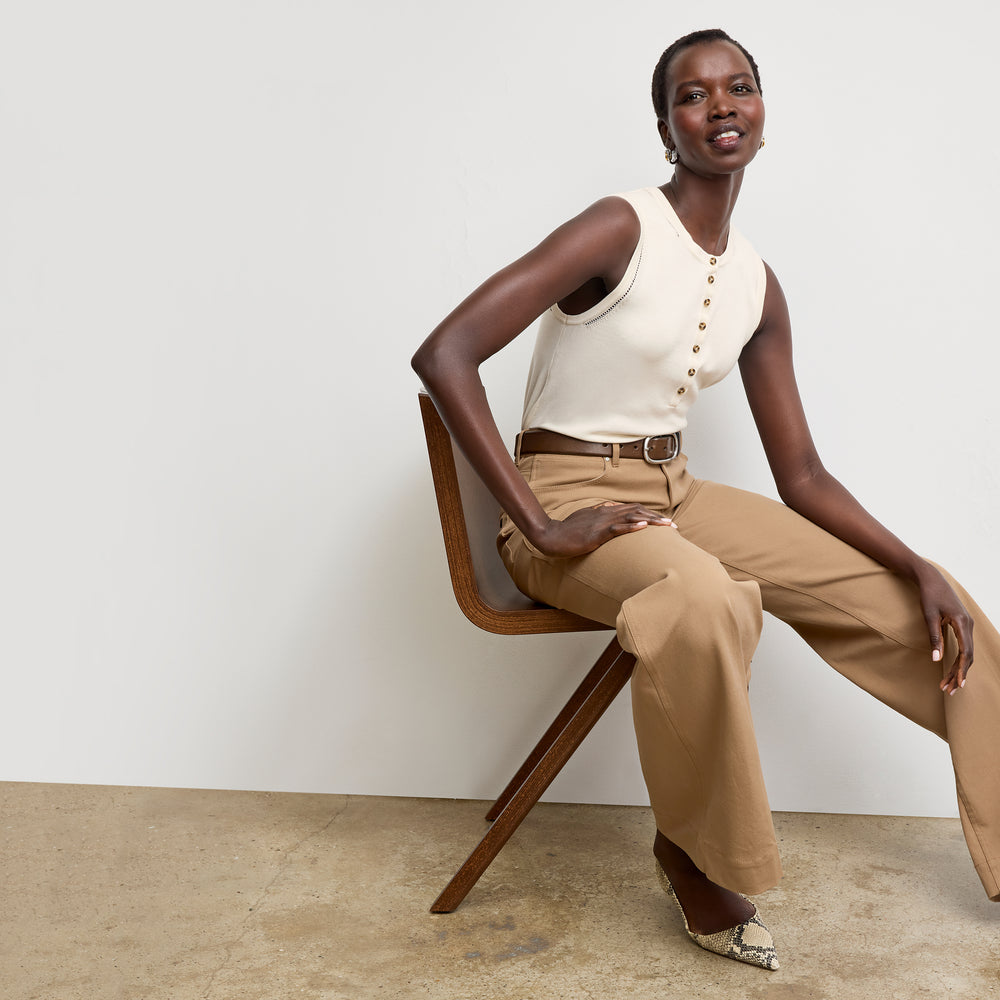 front image of a woman wearing the crimmins top in ivory