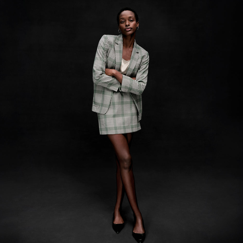 front image of a woman wearing the whitney skirt in check plaid