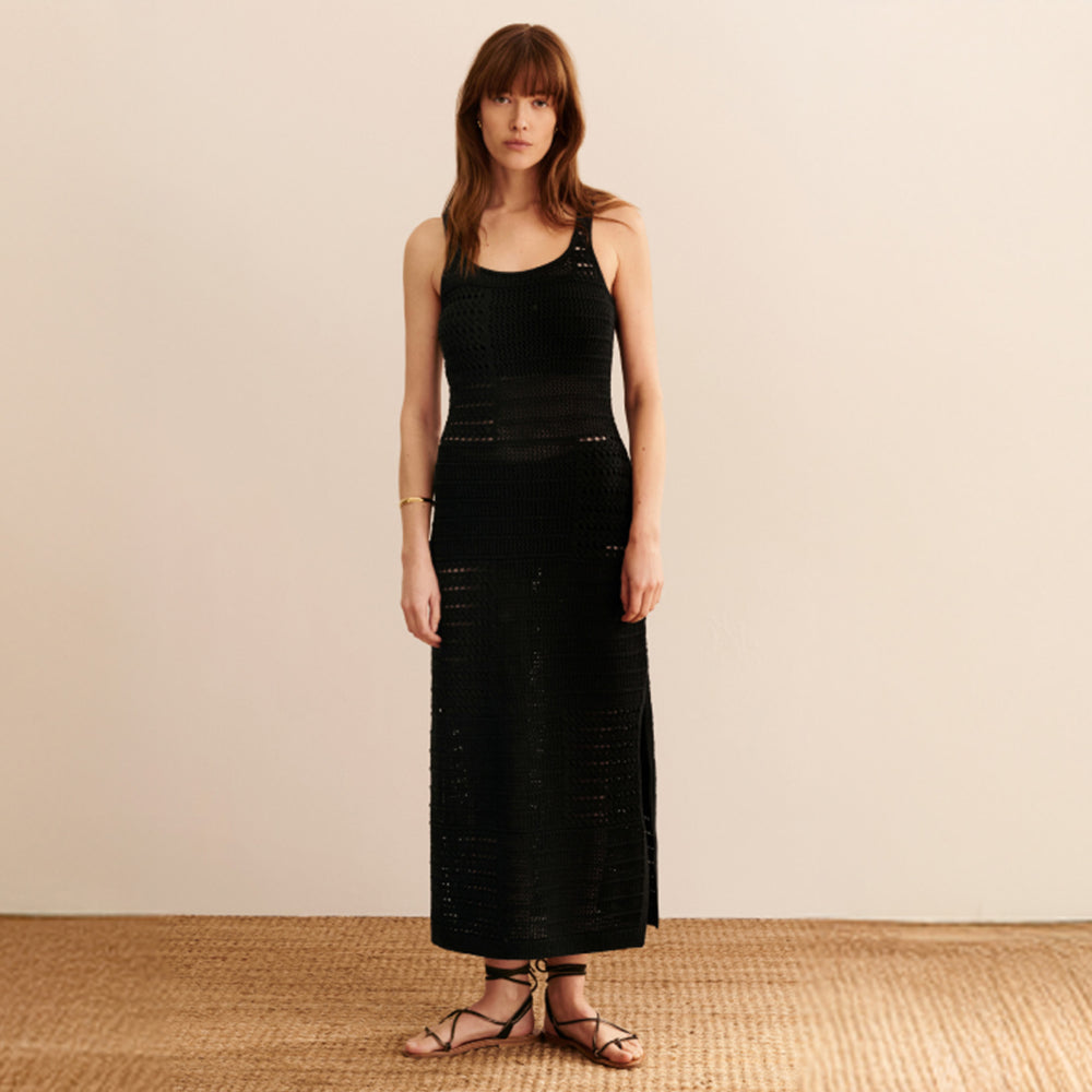 Front image of a woman wearing the Fina Dress in black