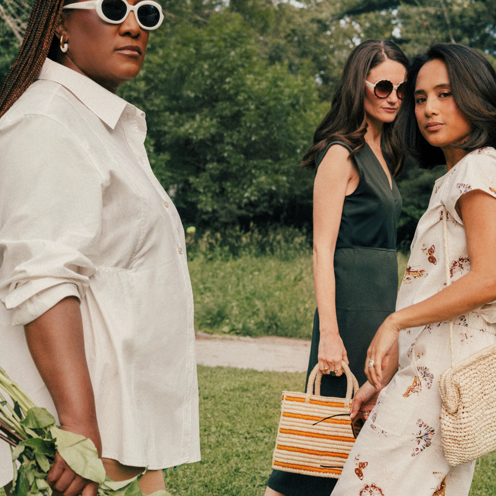 Three women standing outdoors one of them wearing The Madelyn Pull-On Pant - Airy Cotton :: Butterfly Print