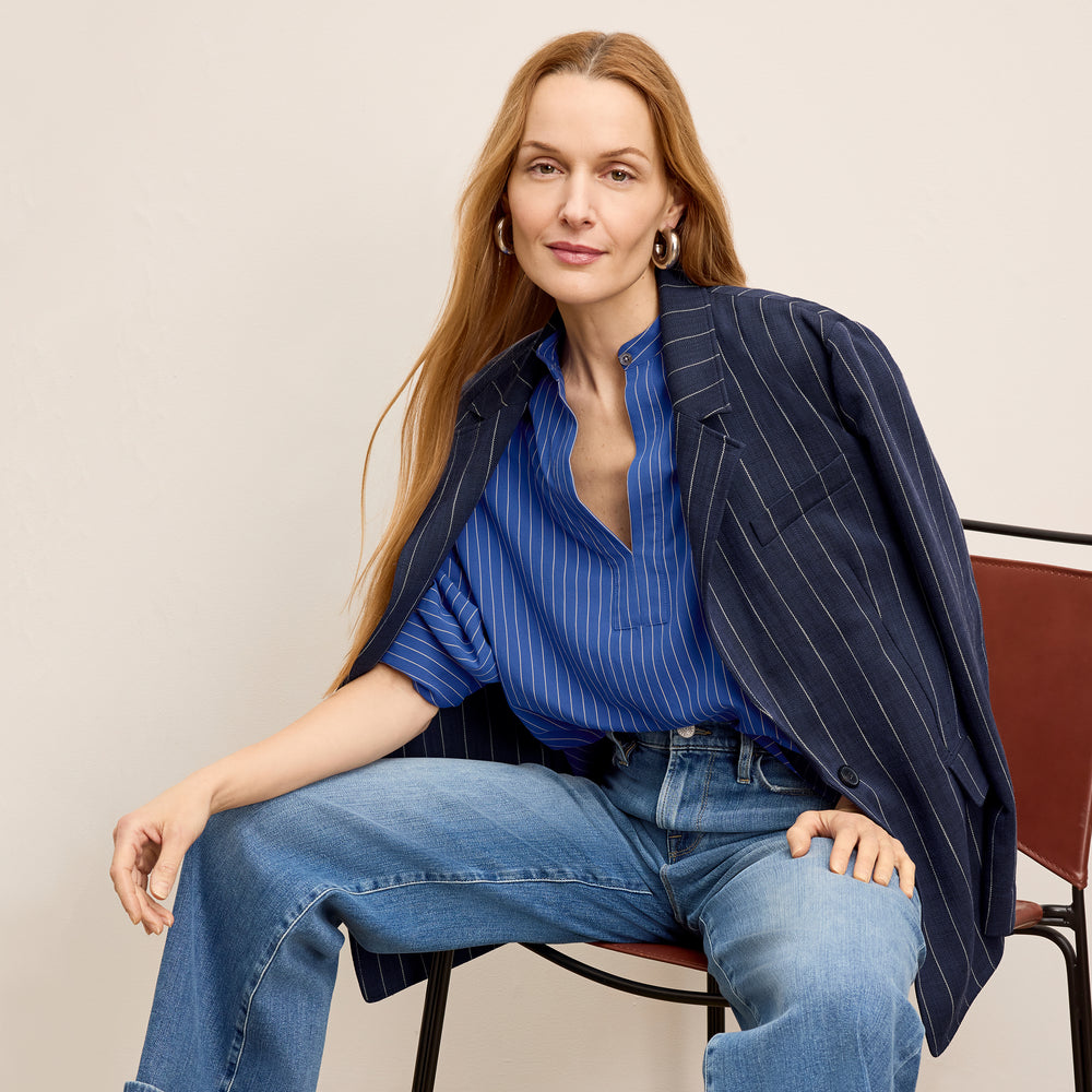 front image of a woman wearing the kylan top in soft stripe