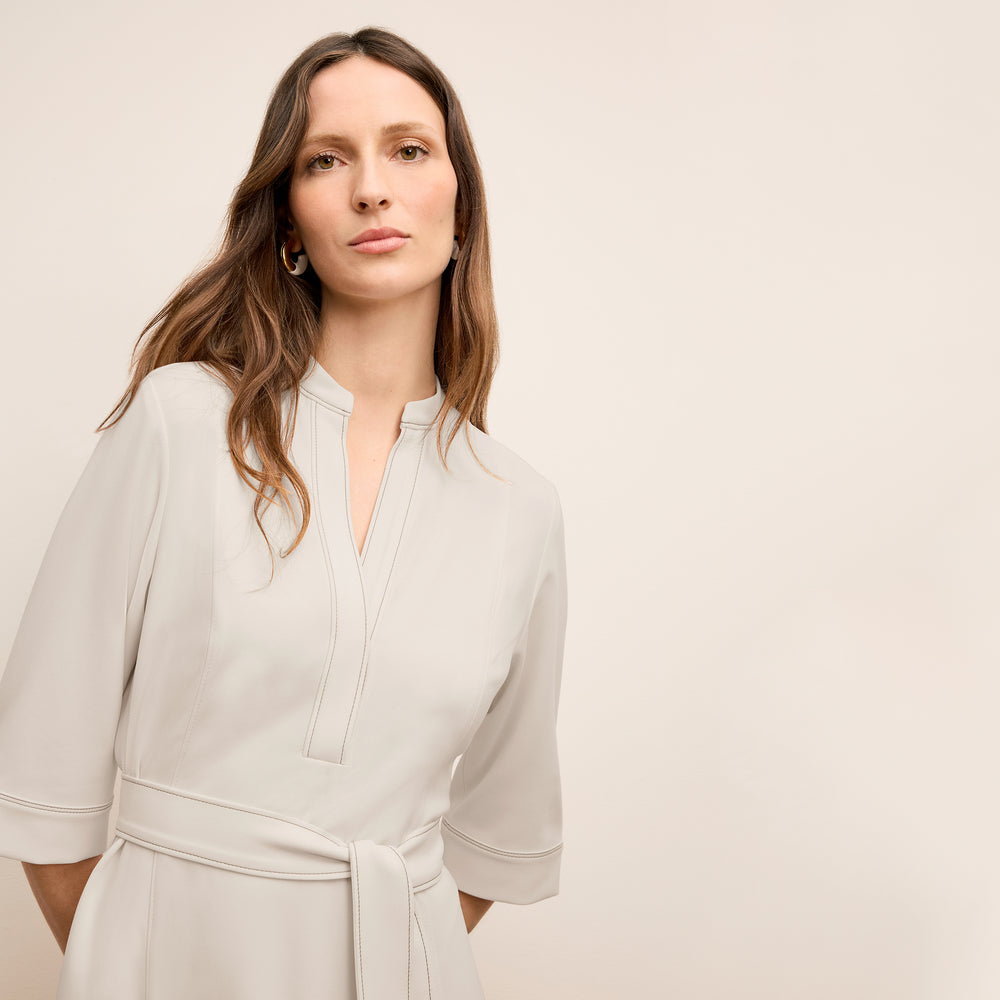 front image of a woman wearing the laueleh dress in eggshell