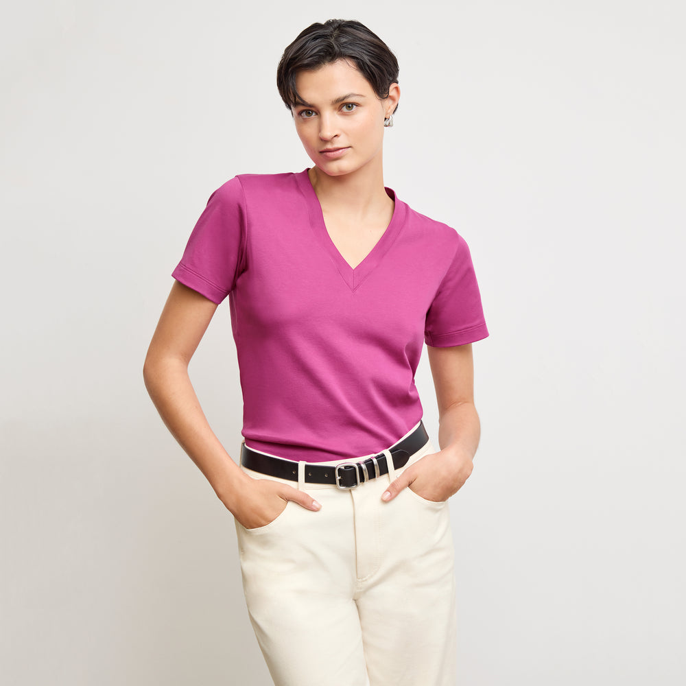front image of a woman wearing the lee t-shirt in pink berry
