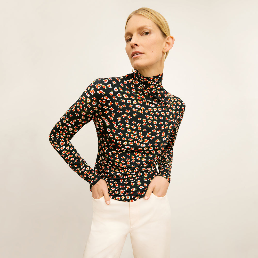front image of a woman wearing the axam top in kaleidoscope print