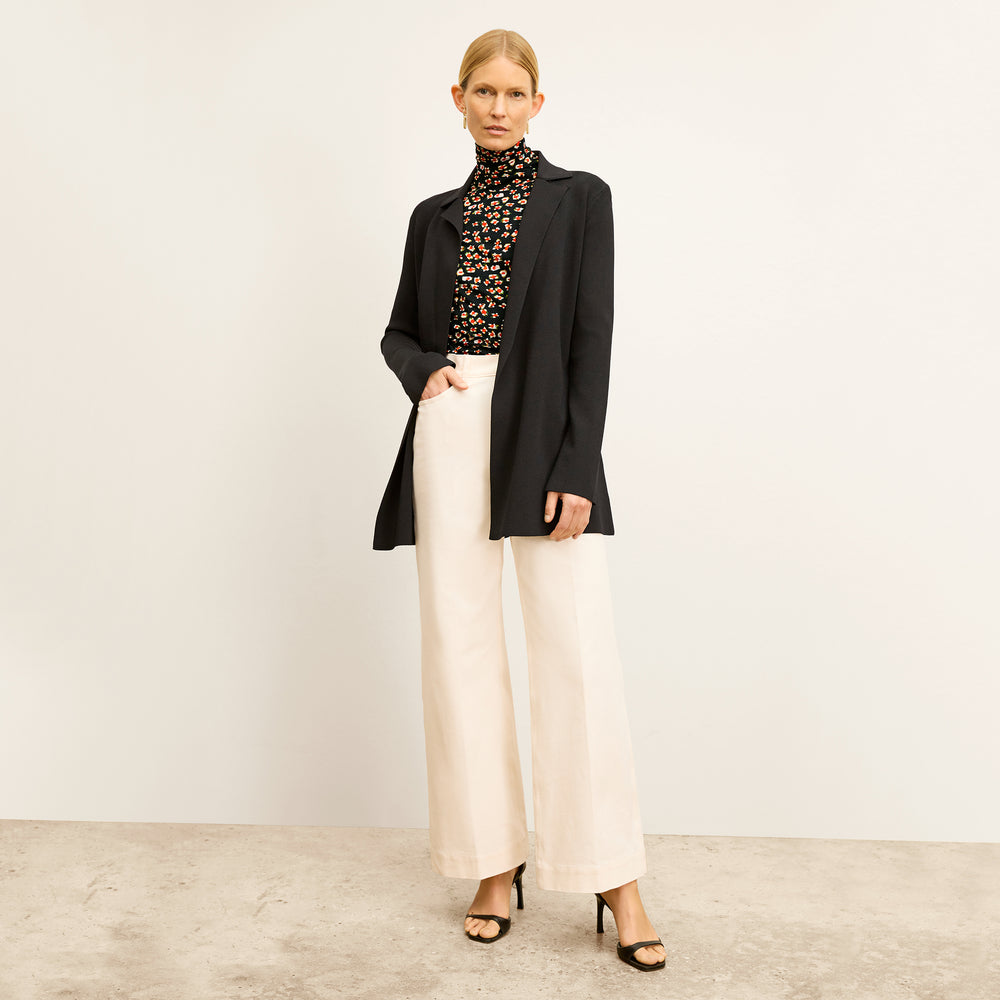 front image of a woman wearing the axam top in kaleidoscope print