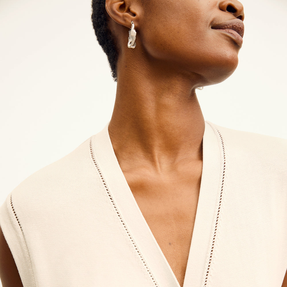 front image of a woman wearing the toula dress in ivory