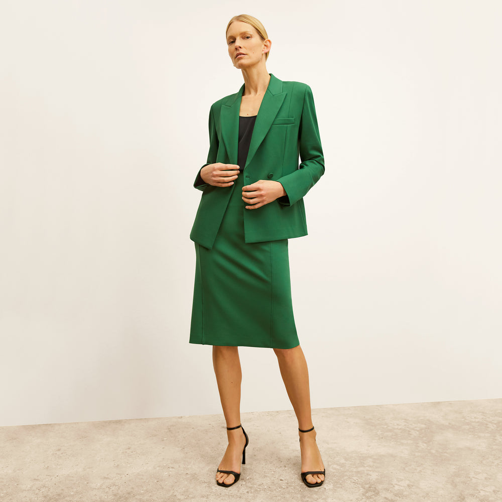 front image of a woman wearing the kenny jacket in shamrock