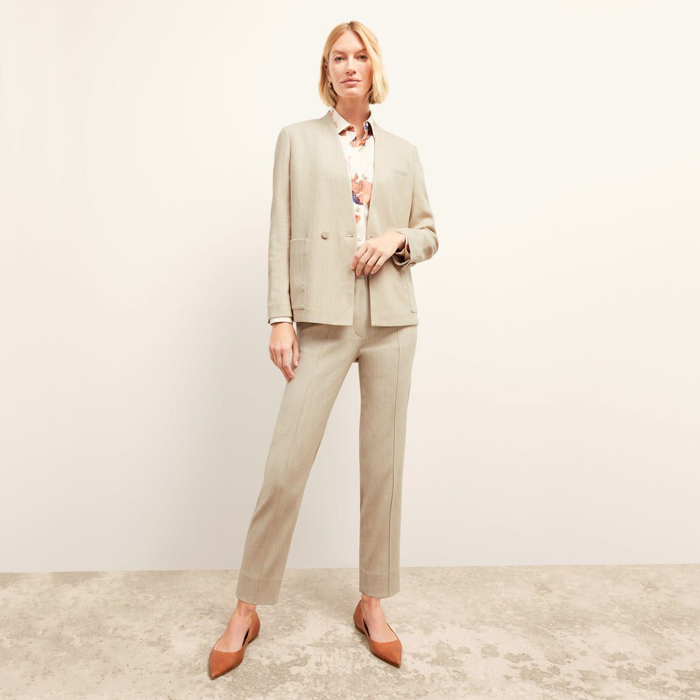 front image of a woman wearing the pearl pant in ivory