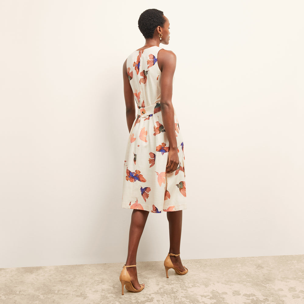 back image of a woman wearing the estela dress in hummingbird print