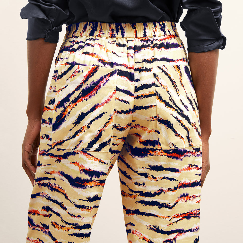 back detail image of a woman wearing the madelyn pant in savannah print