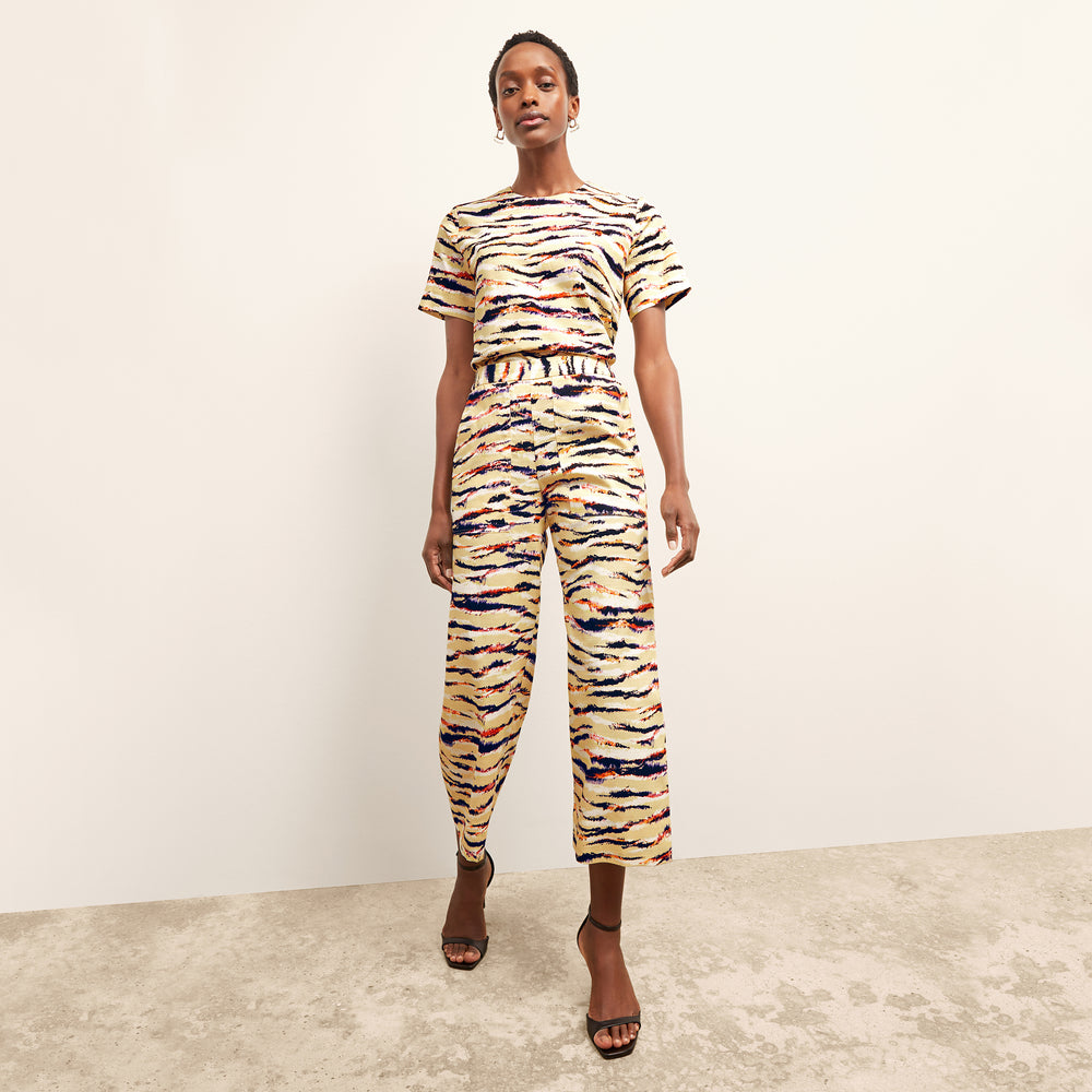 front image of a woman wearing the madelyn pant in savannah print