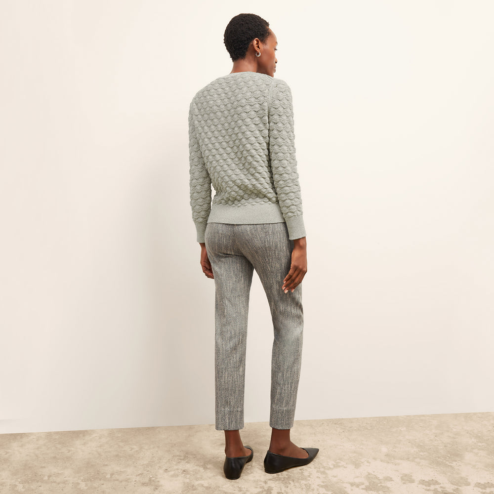 back image of a woman wearing the pearl pant in black/ivory
