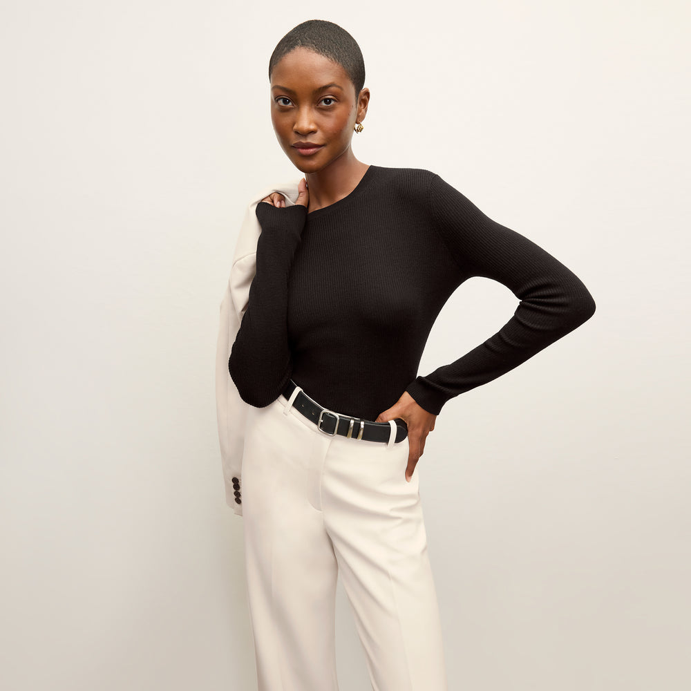 front image of a woman wearing the beck sweater in black