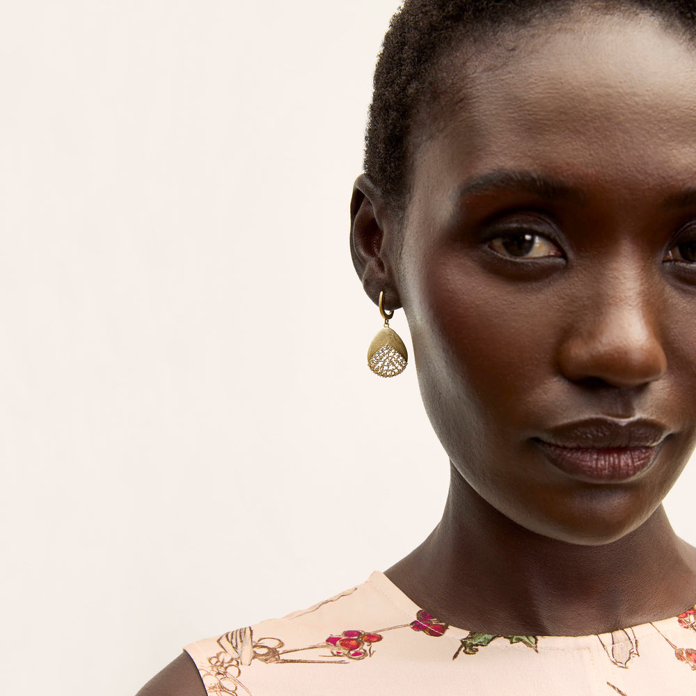 front image of a woman wearing the benia earring