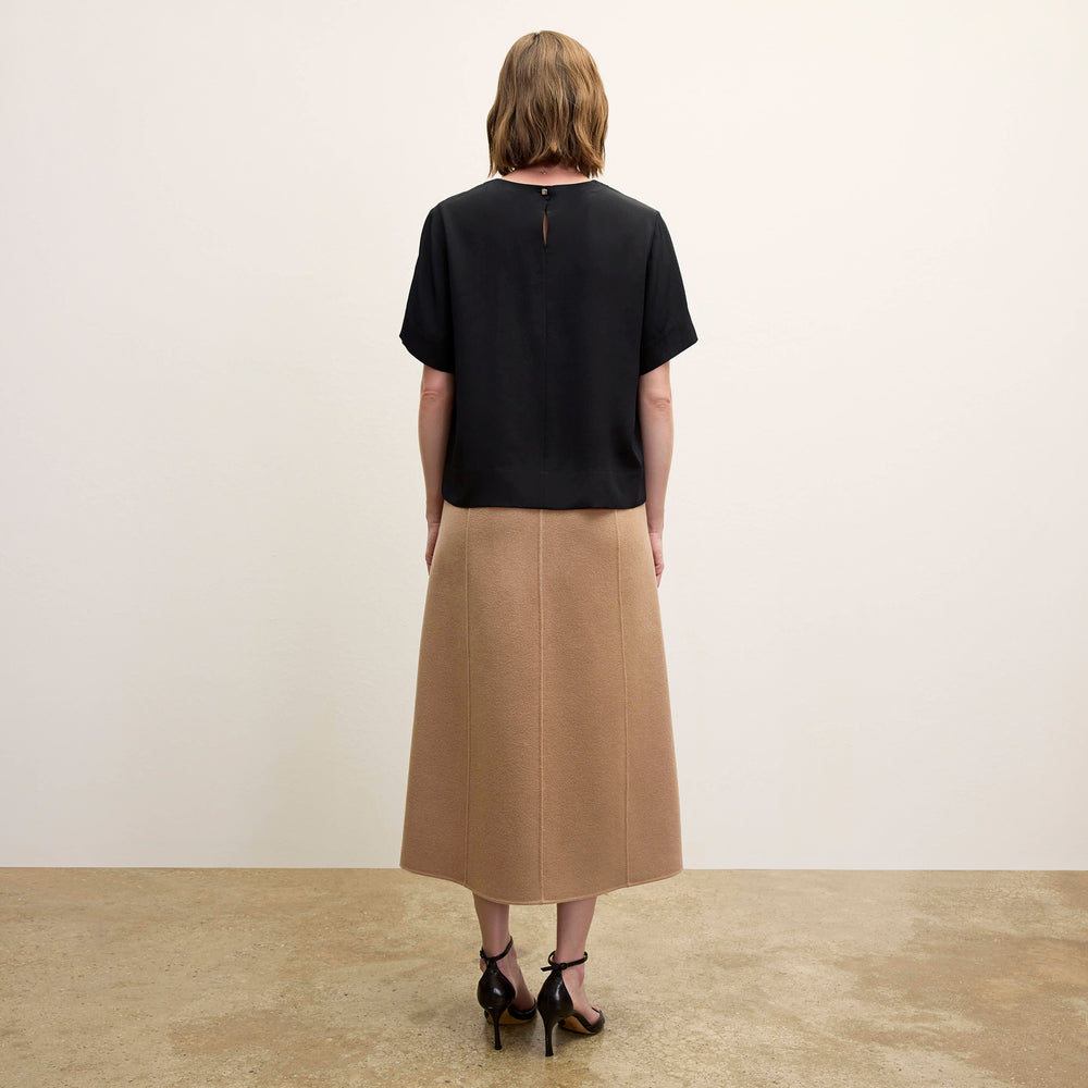 back image of a woman wearing the kerri skirt in camel