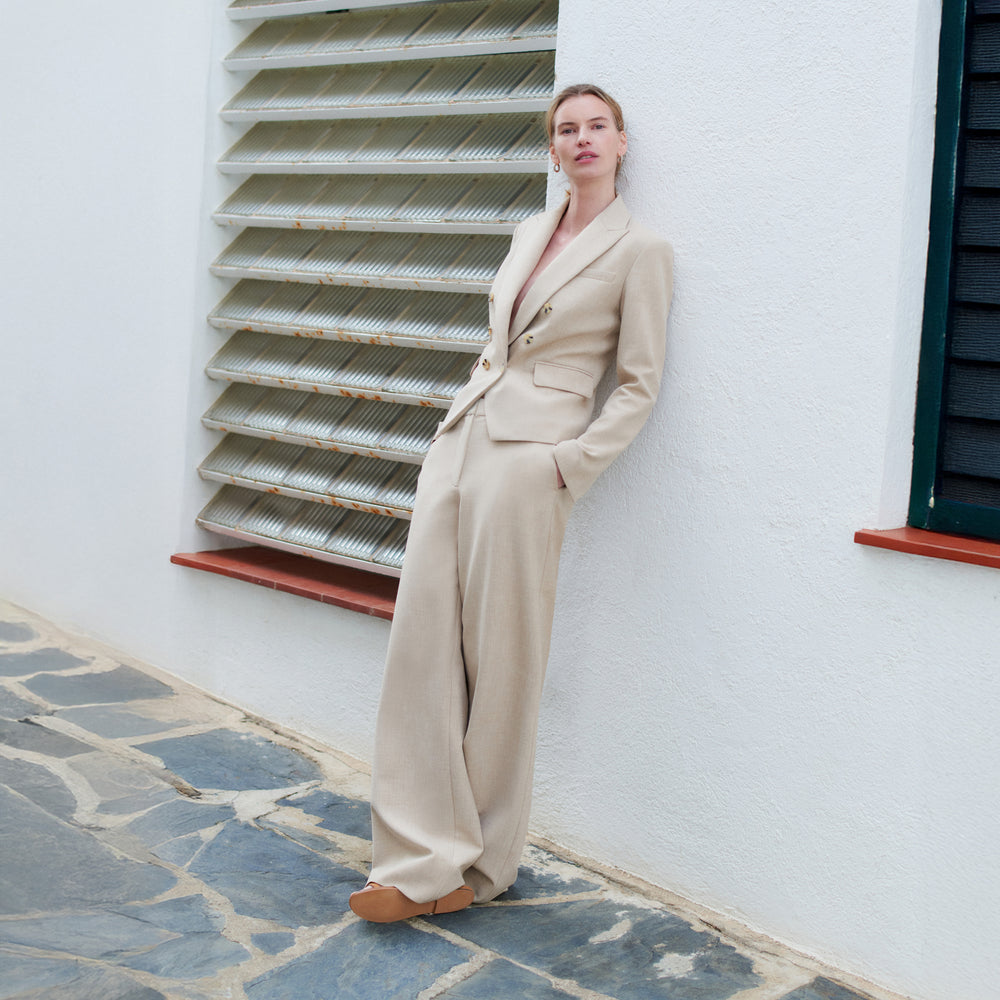 Woman in beige suit.