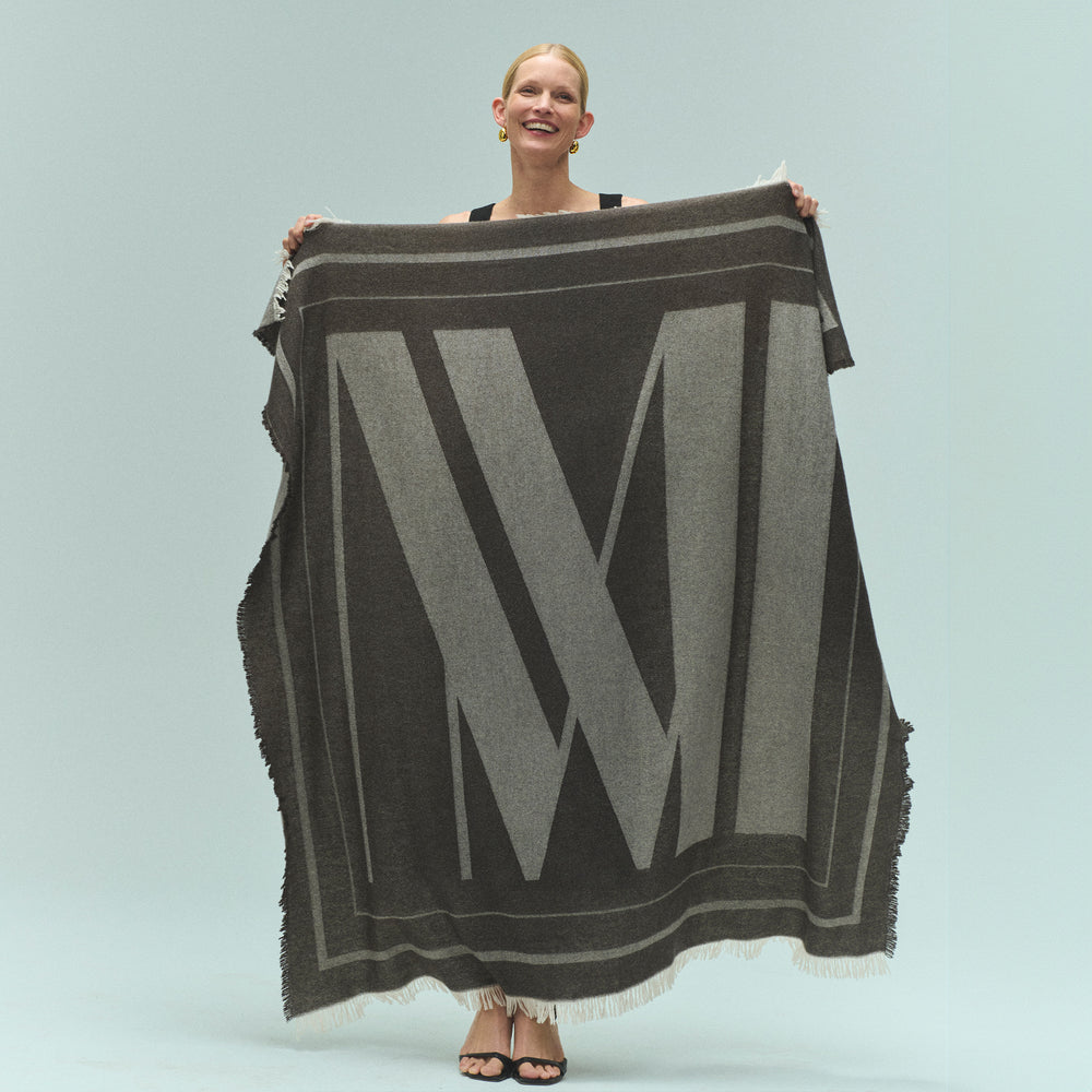 front image of a woman holding the GWP Blanket