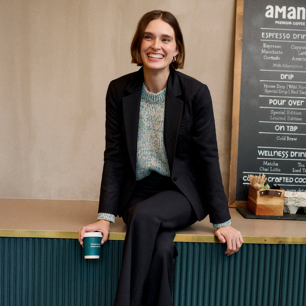front image of a woman wearing the maura sweater in multi