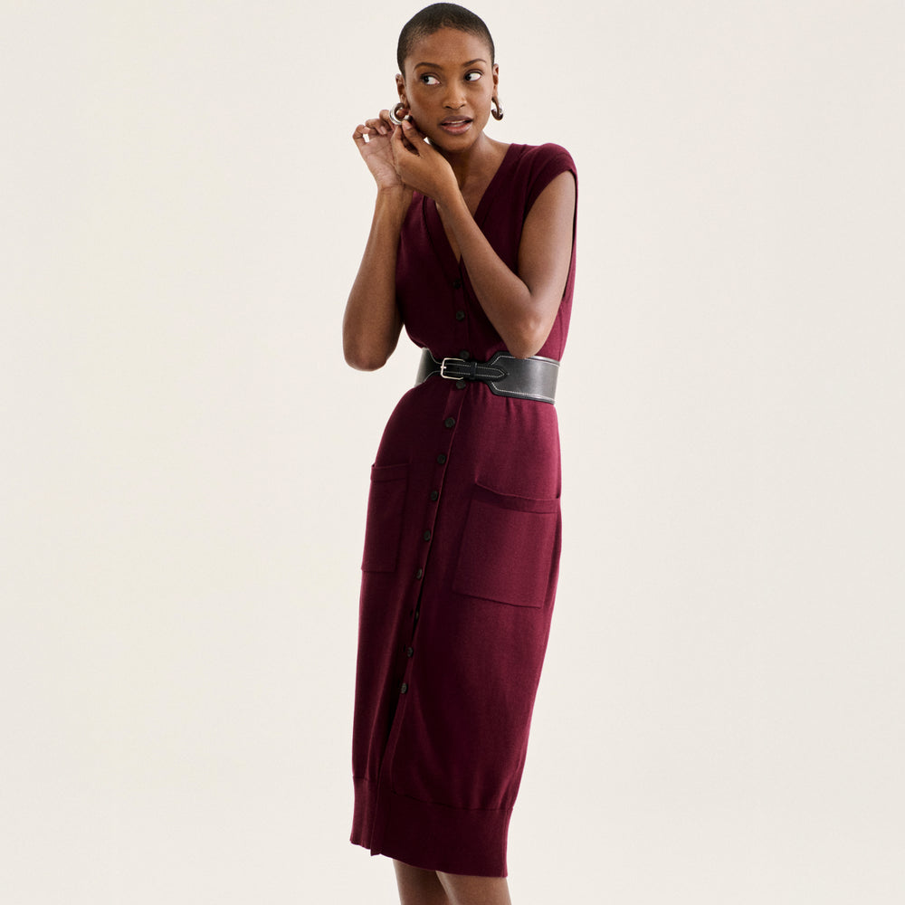 front image of a woman wearing the toula dress in syrah