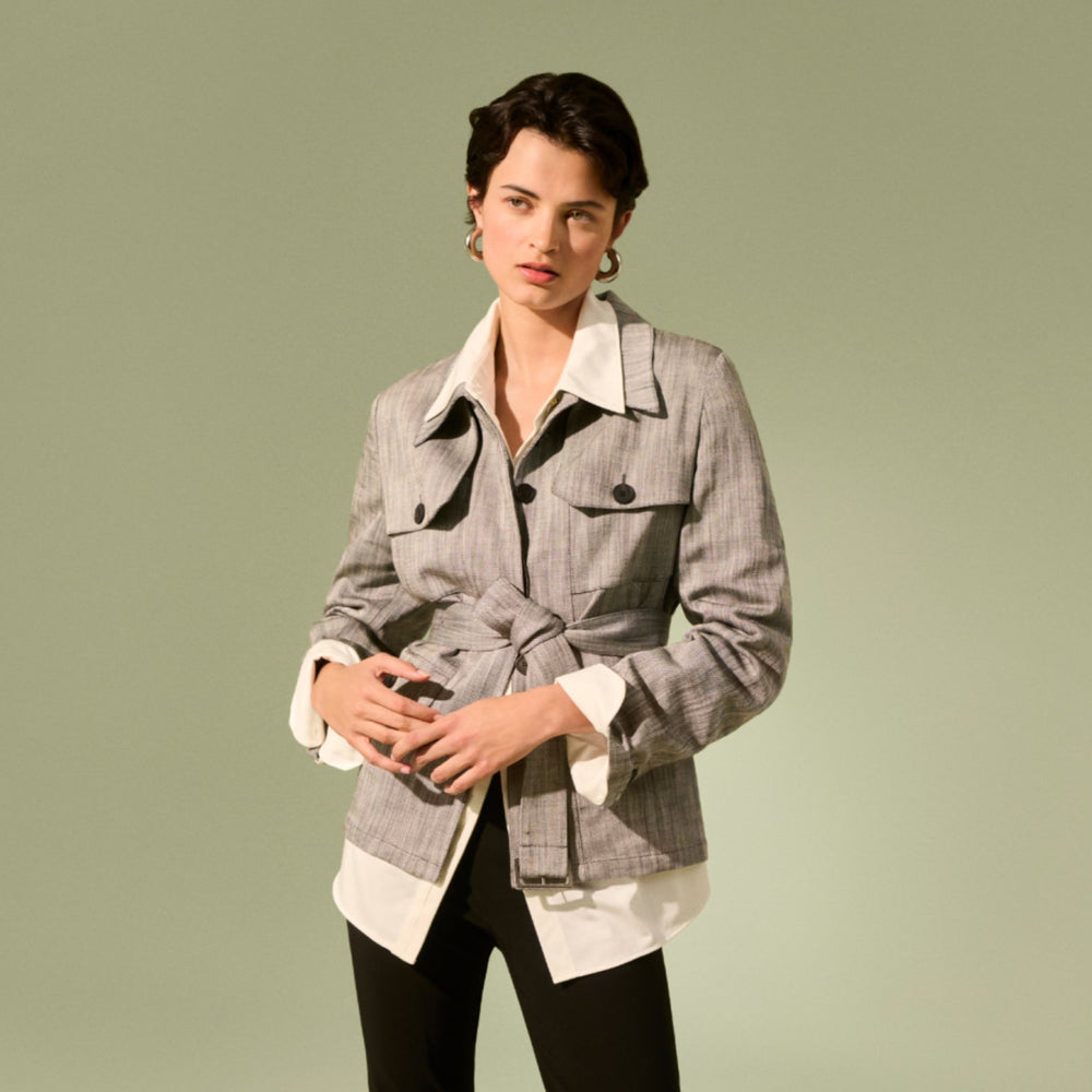 Front image of a woman wearing the emery jacket in Black/White Porto Weave