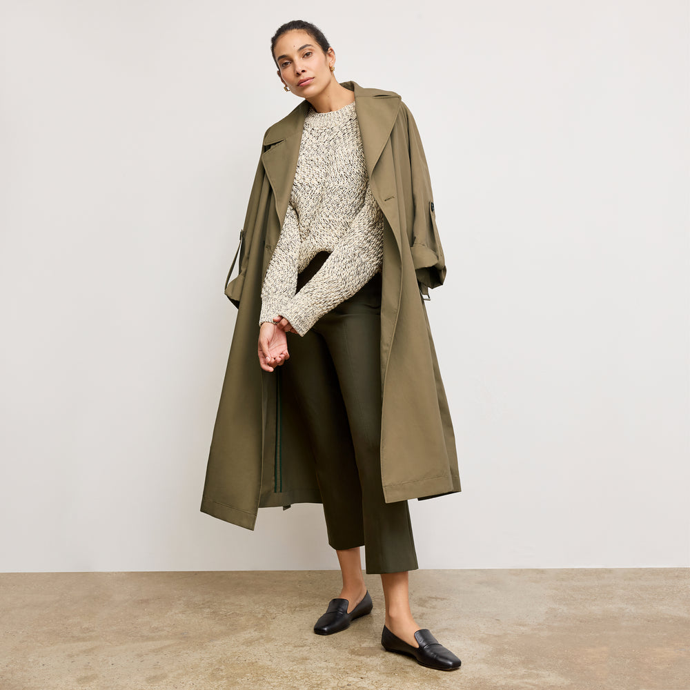 front image of a woman wearing the curtis trench in bancha green