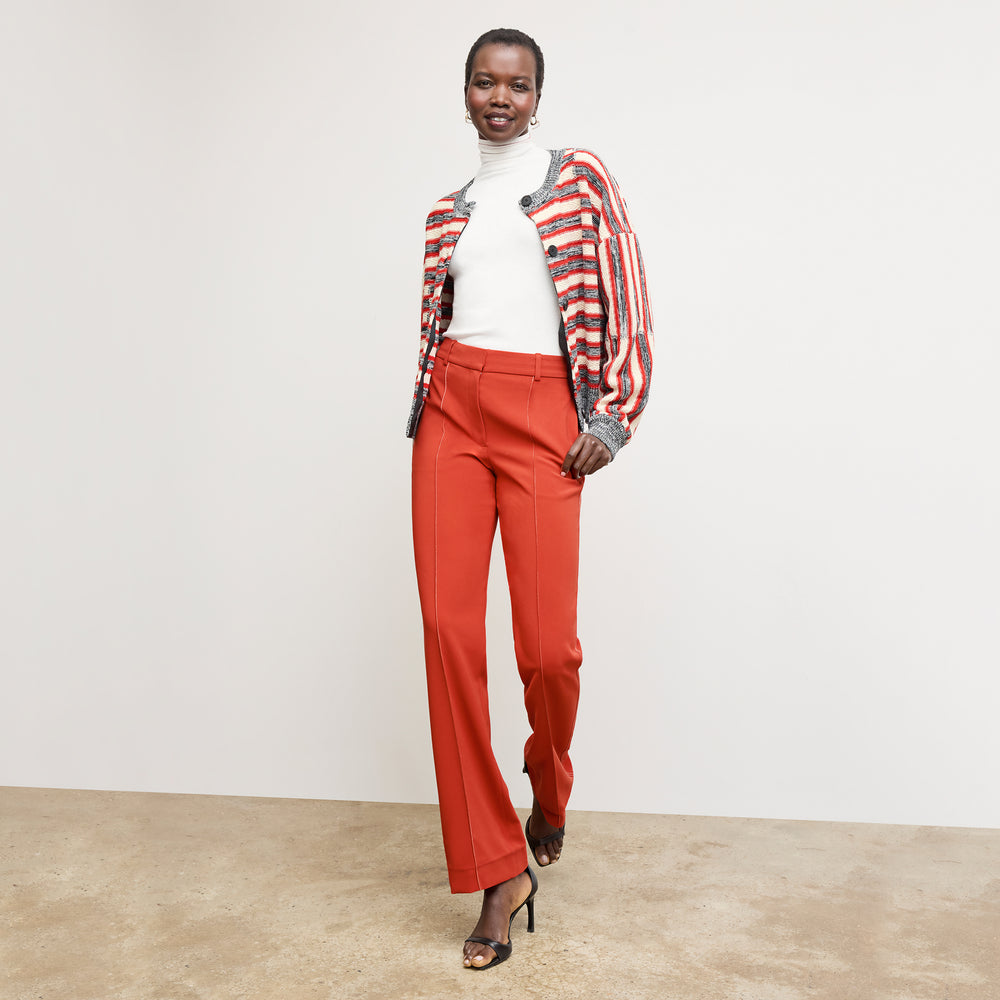 front image of a woman wearing the lowen pant in ginger with topstitch