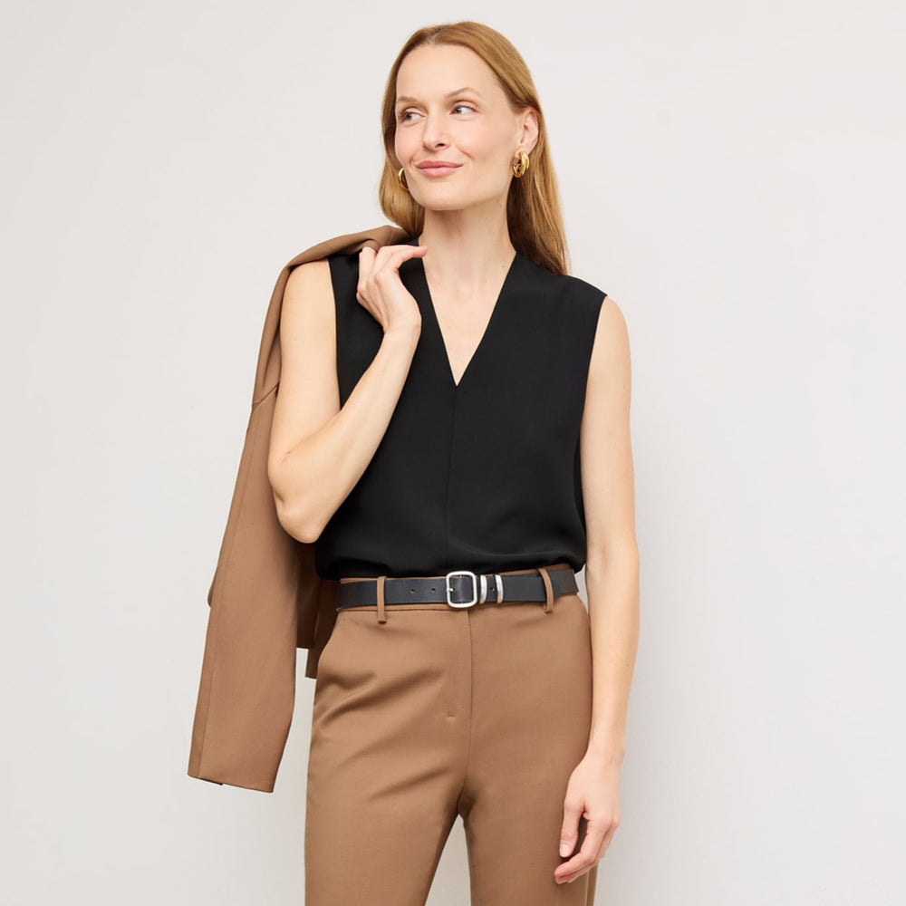 Front image of a woman wearing the Emmy Top in Black