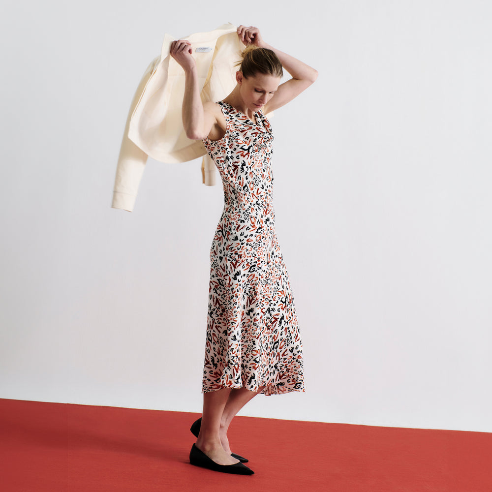 front image of a woman wearing the priya dress in leopard sketch