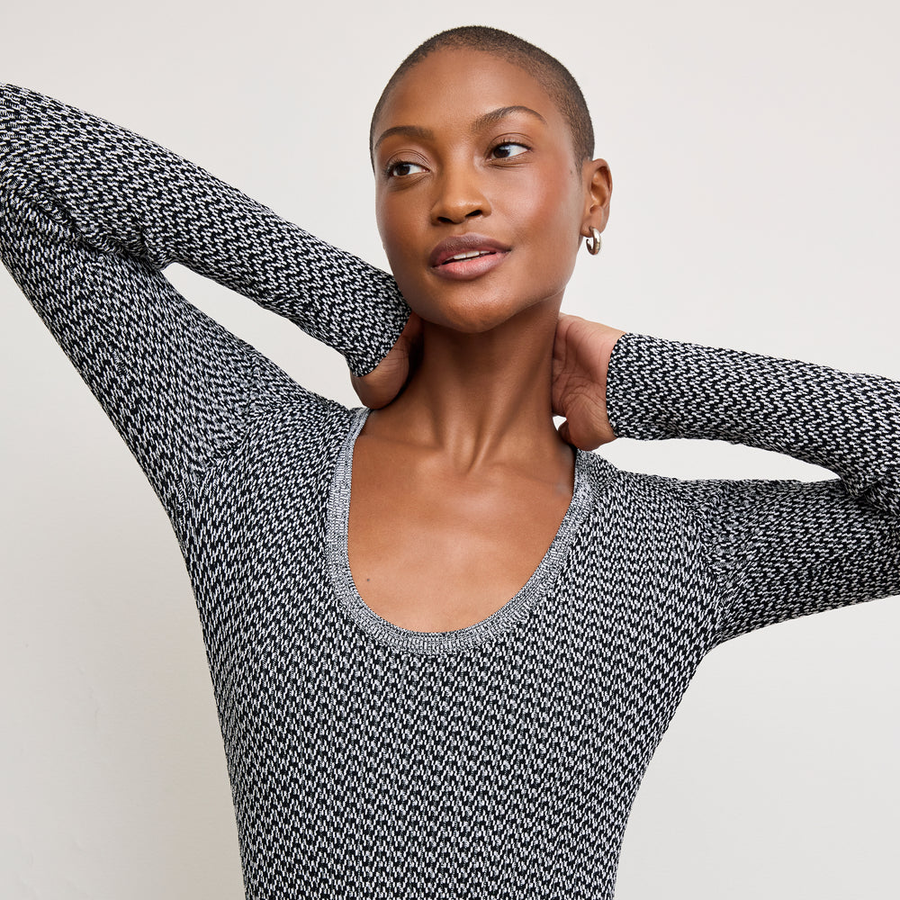 front image of a woman wearing the rae top in mini chevron knit