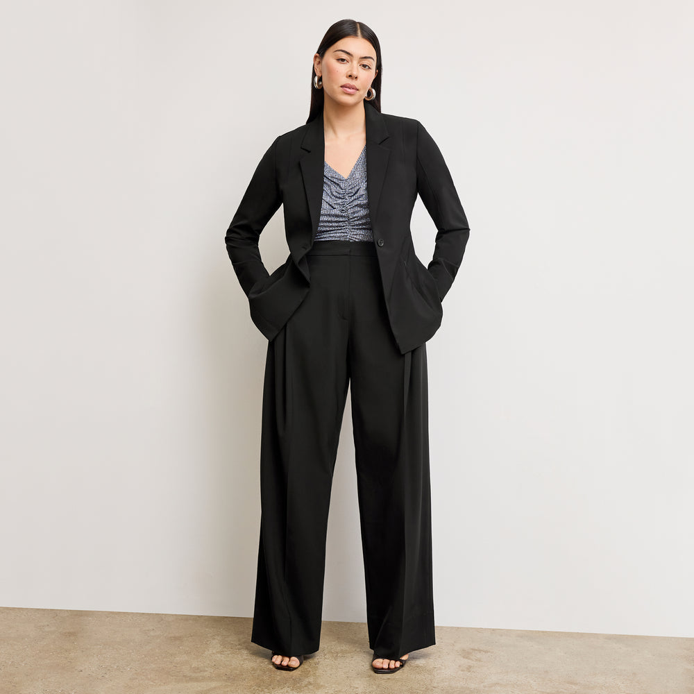 Front image of a woman wearing the amina top in blueprint sketch