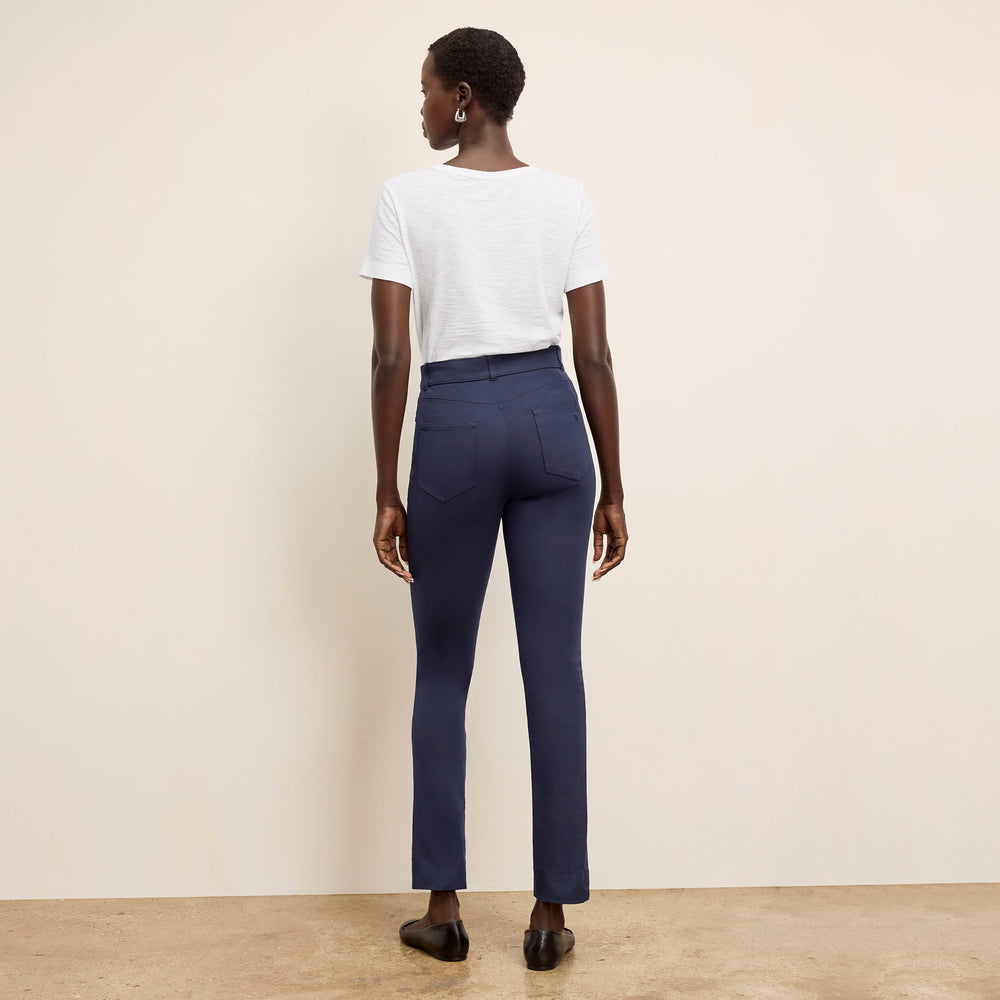 back image of a woman wearing the roma pants in dark navy