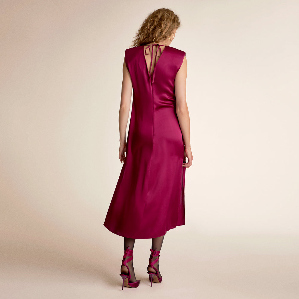 Woman wearing a dark fuchsia dress