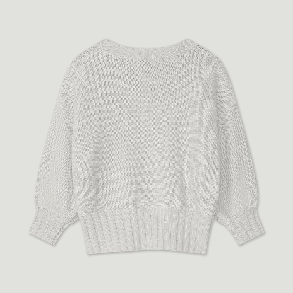 Light gray sweater on a light gray background