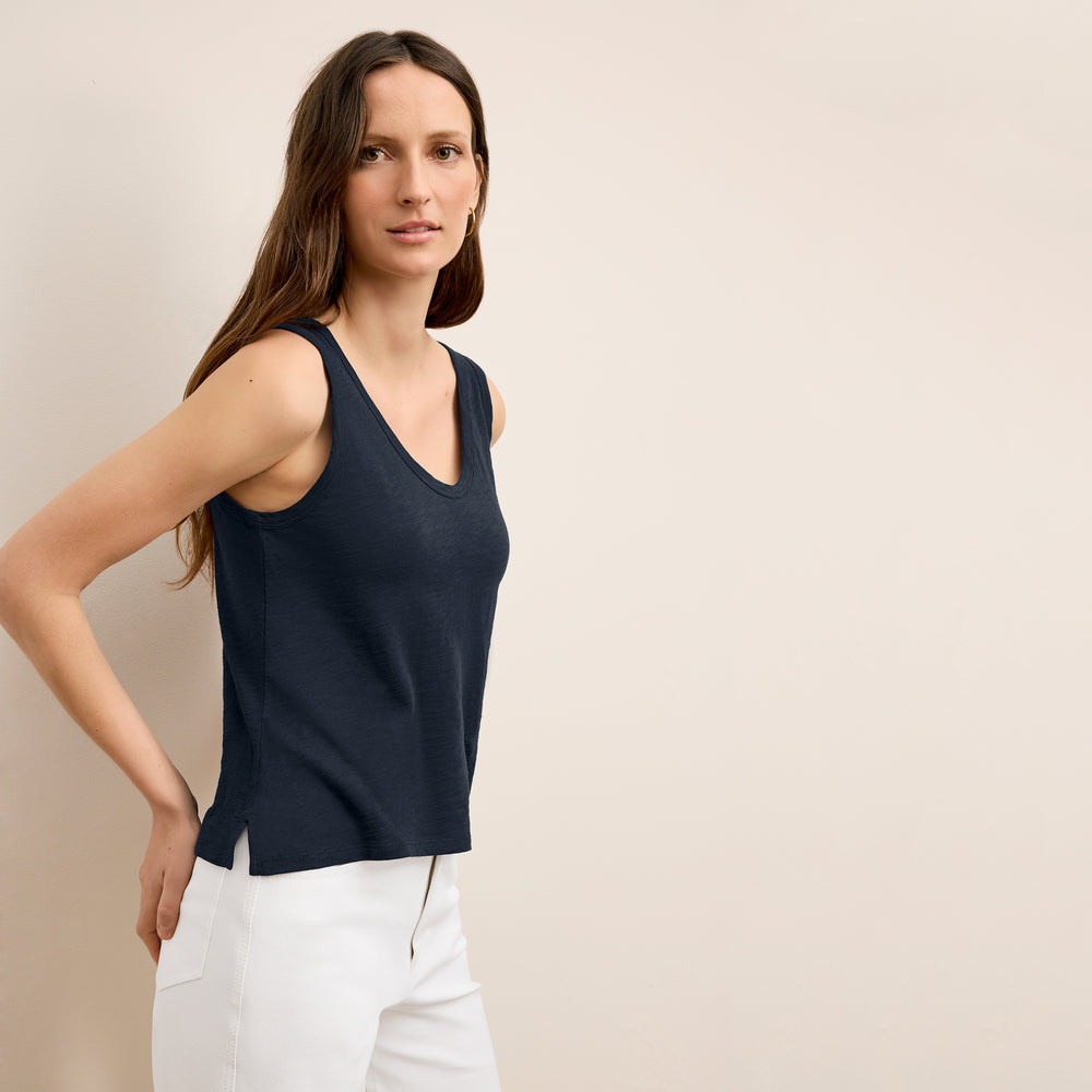 front image of a woman wearing the wyatt tank in dark navy