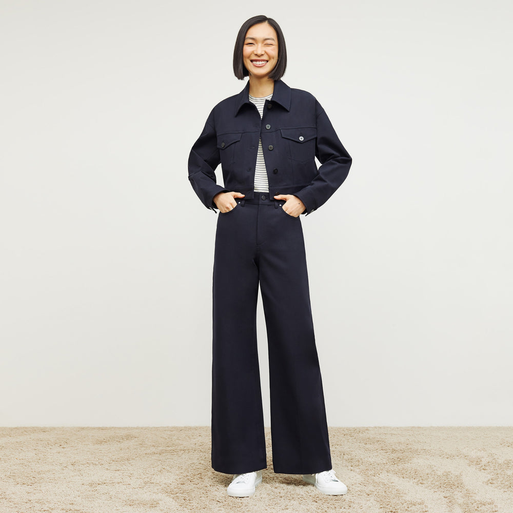 Front image of a woman standing wearing the Milo Jean in ink
