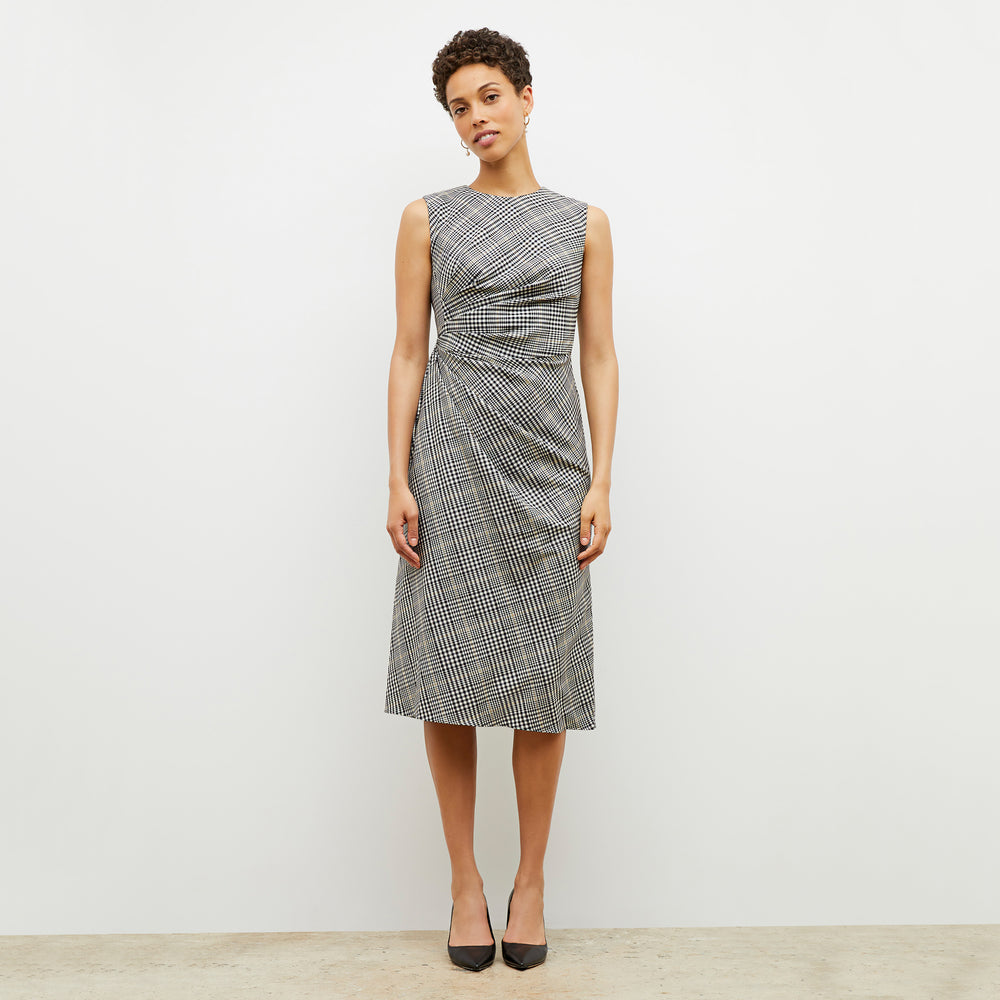Front image of a woman wearing the jeannine dress in plaid sharkskin