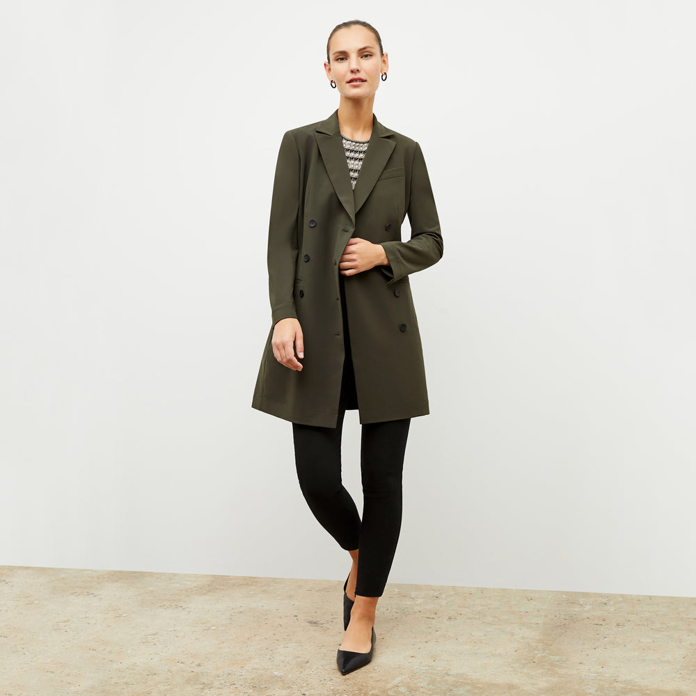 Front image of a woman wearing the gwynne dress in olive