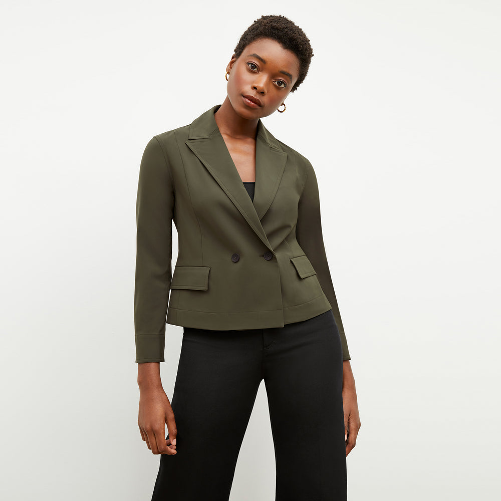Front image of a woman wearing the nia jacket in olive