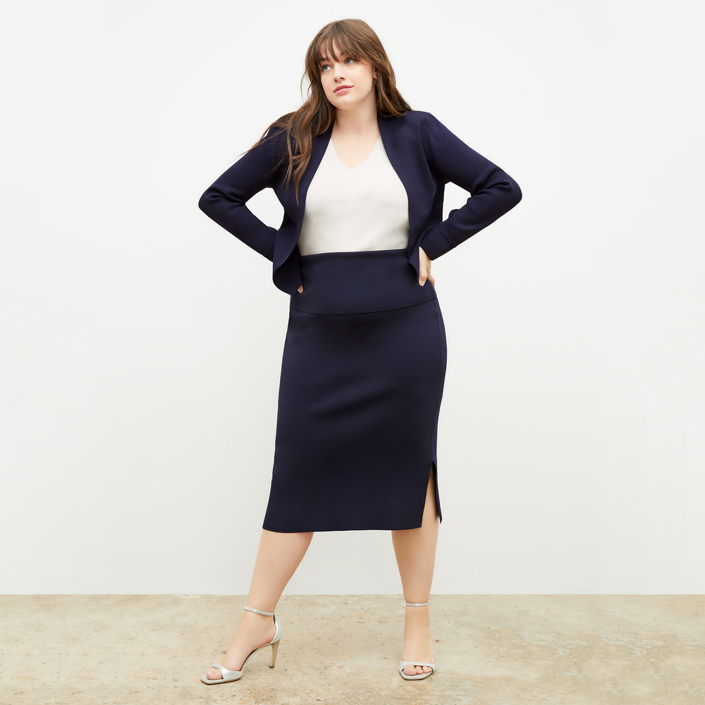 Front image of a woman wearing the harlem skirt in navy