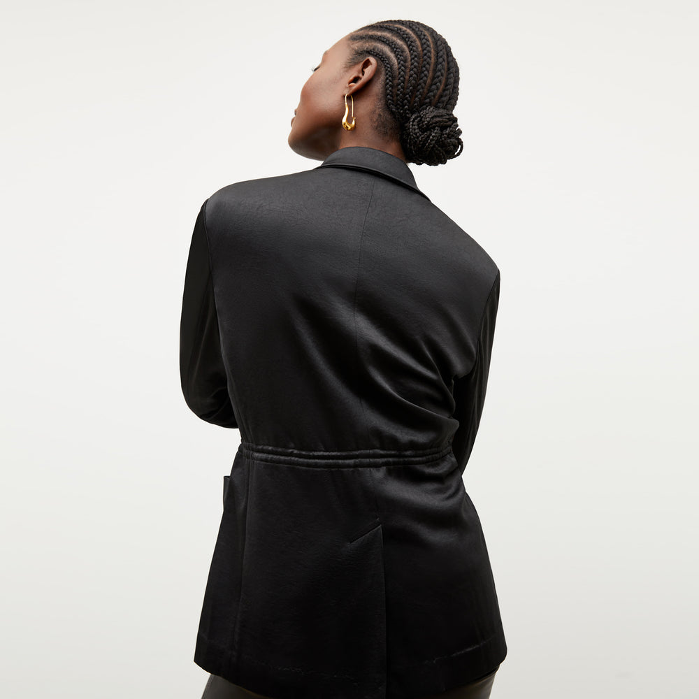 Image of a woman wearing the Hyo Jacket in Black