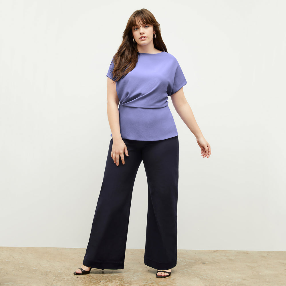 Front image of a woman standing wearing the Milo Jean in ink