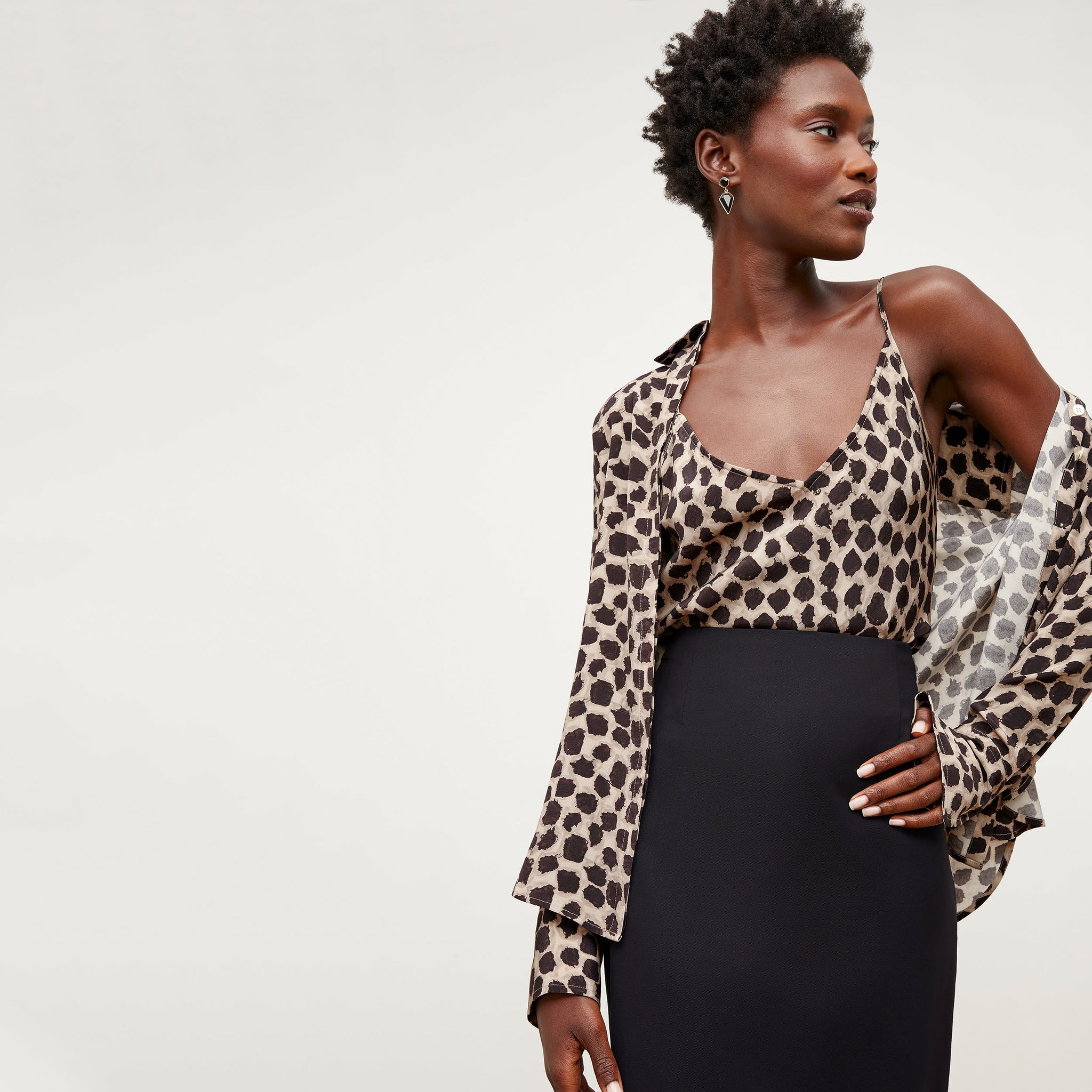 Front image of a woman wearing the tatum shirt in sahara print
